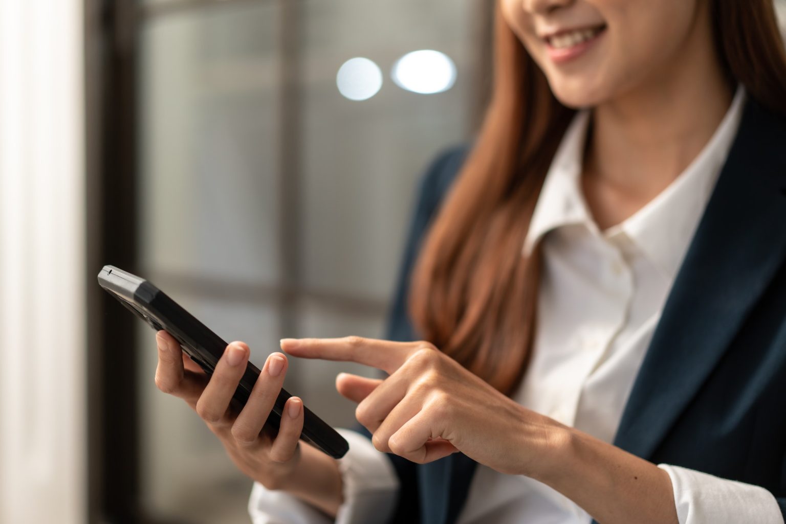 woman is reading financial report and detail of business to reply email of client on smartphone